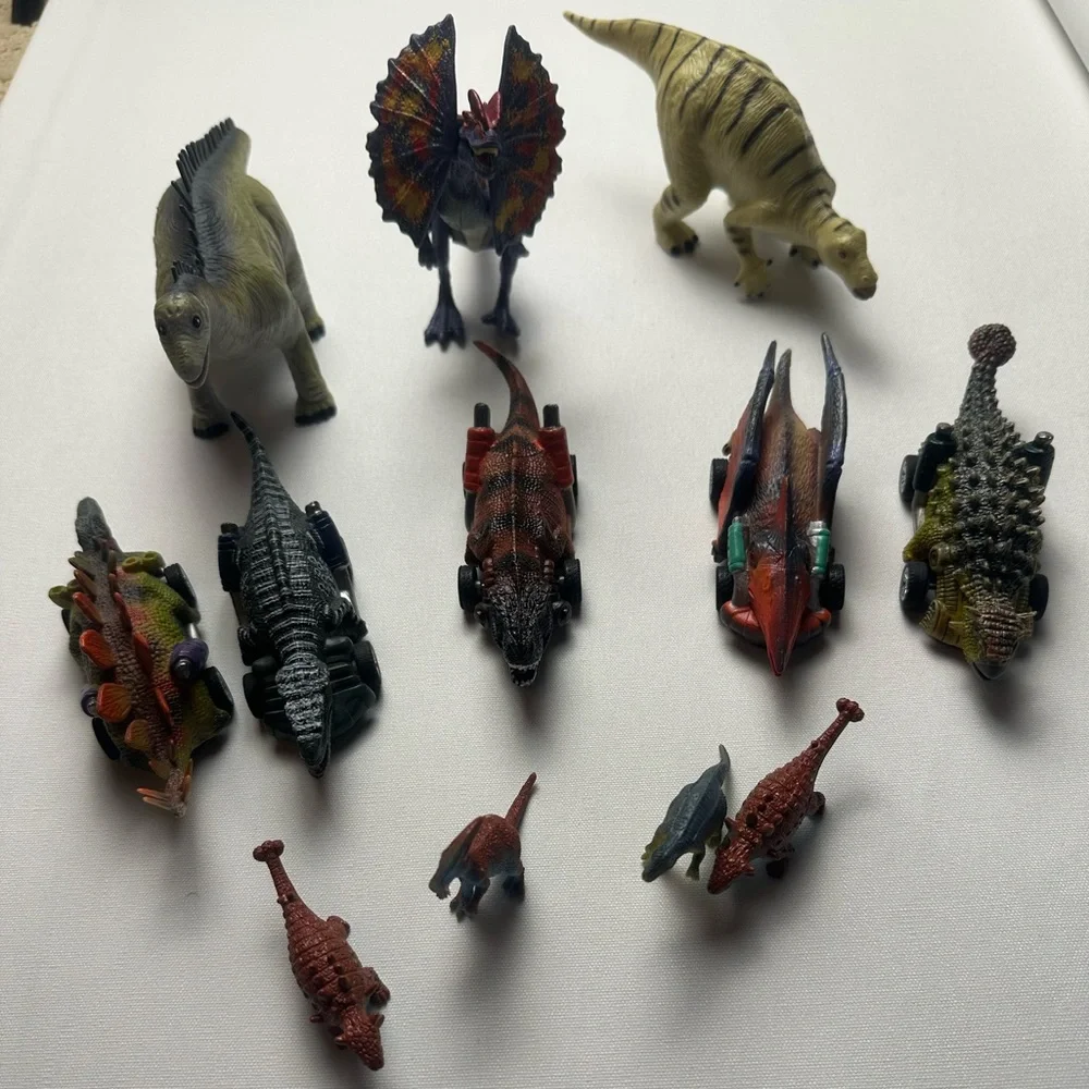 Bundle of multiple sized dinosaurs. 5 are wind up cars. See video.
